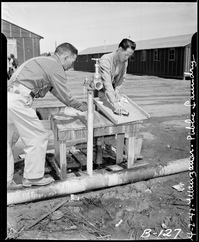 Manzanar Relocation Center, Manzanar, California. A bit of washing is being done by these evacuees . . . - NARA - 536875
