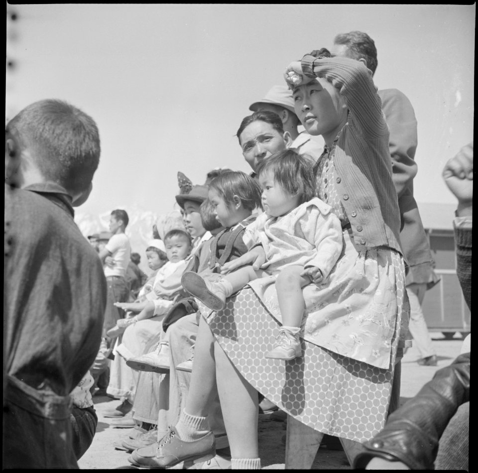 Manzanar Relocation Center, Manzanar, California. A group of evacuees watching a Memorial Day servi . . . - NARA - 538549