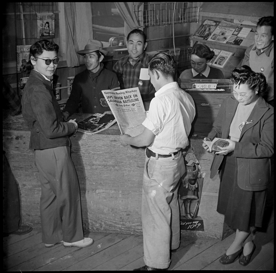 Manzanar Relocation Center, Manzanar, California. A view of the magazine and newpaper stand in the . . . - NARA - 536928