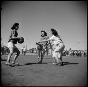 Manzanar Relocation Center, Manzanar, California. Basketball games are part of the regular schedule . . . - NARA - 536938