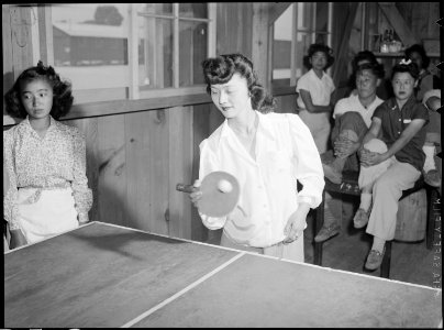 Manzanar Relocation Center, Manzanar, California. Chiyeko Nakashima, high school student, plays tab . . . - NARA - 538484