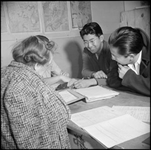 Manzanar Relocation Center, Manzanar, California. Appointed personnel registering evacuees of Japan . . . - NARA - 536723