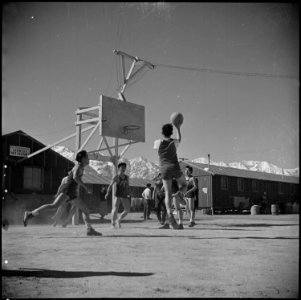 Manzanar Relocation Center, Manzanar, California. Basketball games are part of the regular schedule . . . - NARA - 536935