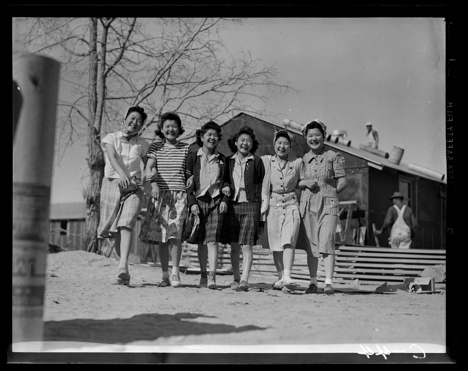 Manzanar Relocation Center, Manzanar, California. Enjoying an afternoon stroll at this War Relocati . . . - NARA - 537422