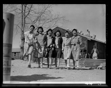 Manzanar Relocation Center, Manzanar, California. Enjoying an afternoon stroll at this War Relocati . . . - NARA - 537422