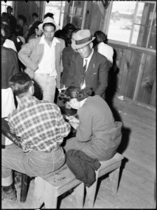 Manzanar Relocation Center, Manzanar, California. Evacuees from Elk Grove, California, signing up f . . . - NARA - 538491