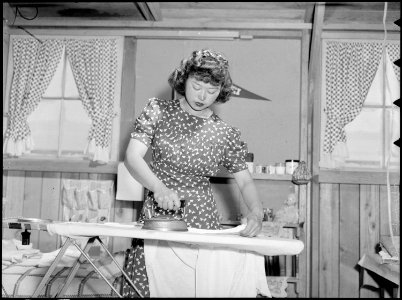 Manzanar Relocation Center, Manzanar, California. Esther Naito, office worker from Los Angeles, is . . . - NARA - 538483