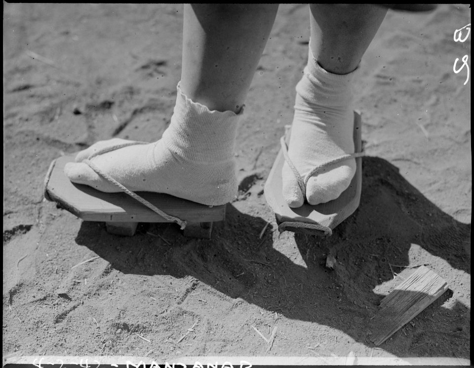 Manzanar Relocation Center, Manzanar, California. Close-up of geta, stilt-like sandals, which are e . . . - NARA - 536753