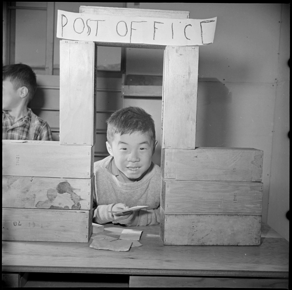 Manzanar Relocation Center, Manzanar, California. First grade pupils play Post Office, in this cl . . . - NARA - 536703