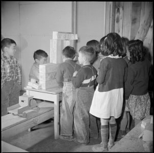 Manzanar Relocation Center, Manzanar, California. First grade students play post office in this cla . . . - NARA - 536702 photo