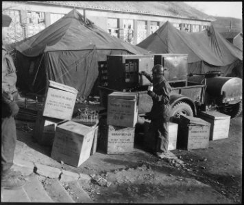 Major Sergeant, George Miller selects human blood for patient at the 8076th Mobile Army Surgical Hospital at Kunu-ri... - NARA - 531393