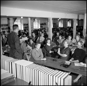 Manzanar Relocation Center, Manzanar, California. Lt. Eugene Bogard explaining the methods of regis . . . - NARA - 536719
