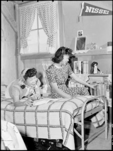 Manzanar Relocation Center, Manzanar, California. Oko Murata (left), and Esther Naito, office worke . . . - NARA - 538482