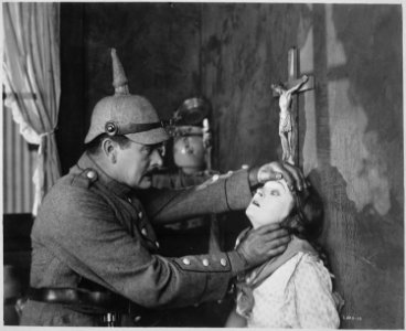 Mae Marsh, as a Belgian girl, and A. C. Gibbons as a German soldier, in Goldwyn's all-star Liberty Loan picture, Stake - NARA - 516486