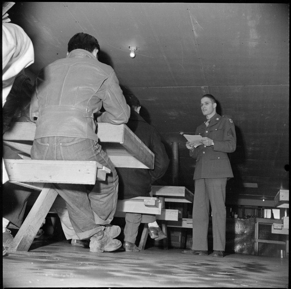 Manzanar Relocation Center, Manzanar, California. Sergeant Victor Tierman explains the purpose of r . . . - NARA - 536711