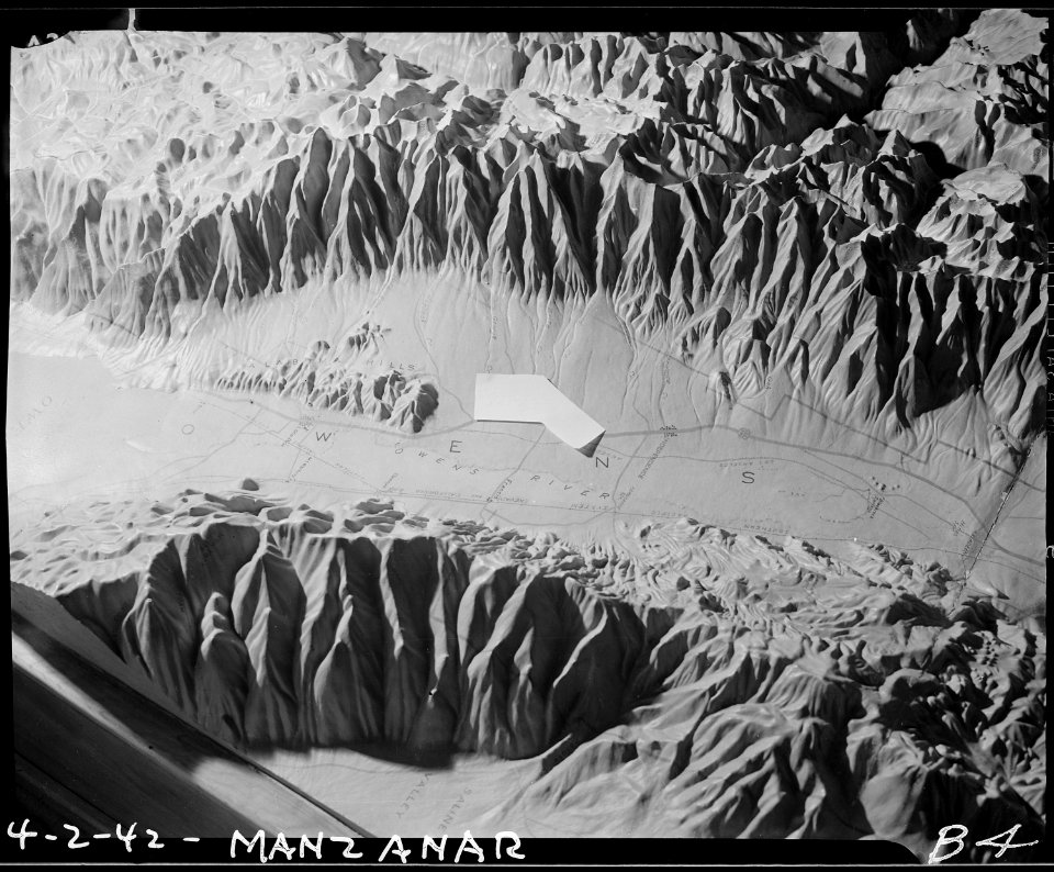Manzanar Relocation Center, Manzanar, California. Picture of relief map showing location of Manzana . . . - NARA - 536754
