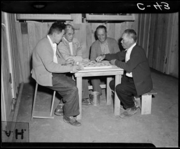 Manzanar Relocation Center, Manzanar, California. Playing Japanese checkers at this War Relocation . . . - NARA - 537421