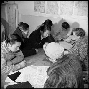 Manzanar Relocation Center, Manzanar, California. Residents of Japanese ancestry registering for in . . . - NARA - 536722 photo