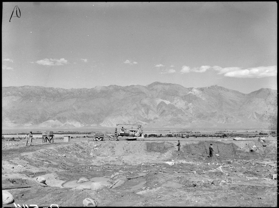 Manzanar Relocation Center, Manzanar, California. View of construction of water reservoir at Manzan . . . - NARA - 538512