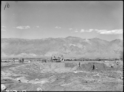 Manzanar Relocation Center, Manzanar, California. View of construction of water reservoir at Manzan . . . - NARA - 538512