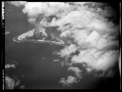 Marcus Island goes up in smoke and flames after raid by planes from USS Yorktown CV-10. - NARA - 520944