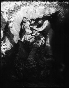 Marine Corporal Earl Brunitt (left) and Private Genare Nuzzi share a foxhole and a couple of ponchos on Okinawa with... - NARA - 532551