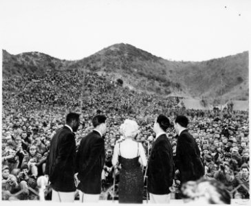 Marilyn Monroe sings several songs for an estimated 13,000 men of the First Marine Division. Miss Monroe stopped at... - NARA - 532471