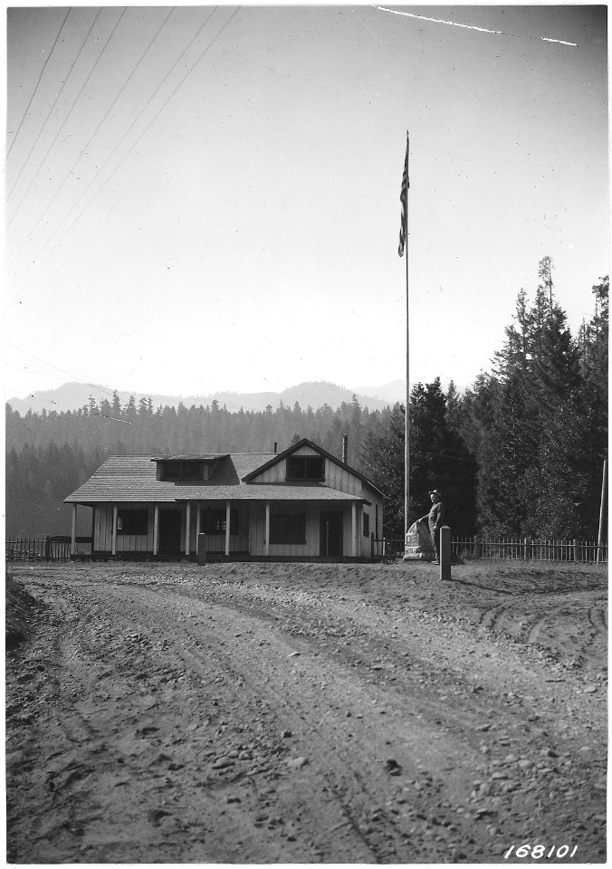 Mckenzie Bridge Ranger Station, Pioneers' Monument with Ranger Taylor. - NARA - 299204