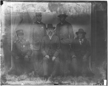 Members of U.S. Indian Police, with white man - NARA - 523707