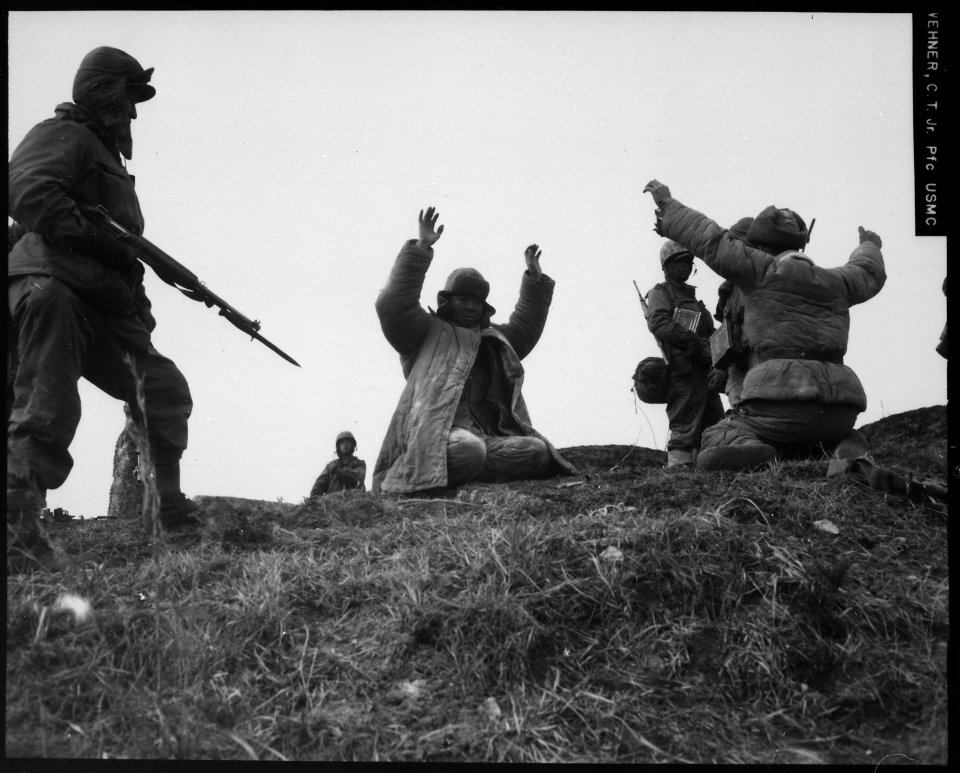 Men of the 1st Marine Division capture Chinese Communists during fighting on the central Korean front. Hoengsong... - NARA - 532414