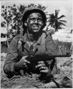 Marine awaits signal to go ahead in battle to recapture Guam from Japanese. - NARA - 520969