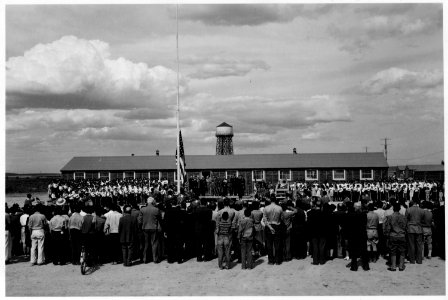 Minidoka Relocation Center, Hunt, Idaho. Dedication of the project flag and flag pole in the admini . . . - NARA - 539489