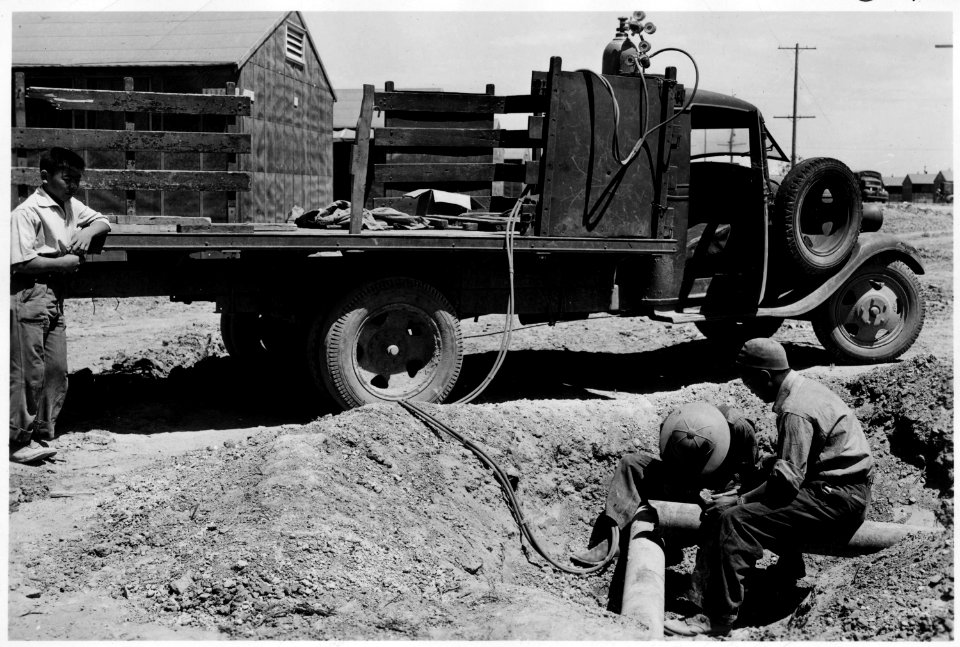 Minidoka Relocation Center, Hunt, Idaho. Members of adult education welding class using portable outfit. - NARA - 539484