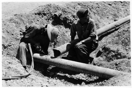 Minidoka Relocation Center, Hunt, Idaho. Adult education class members using portable welding outfit. - NARA - 539486