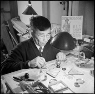 Minidoka Relocation Center, Minidoka, Washington. Watch repair shop. Sokichi Hoshide, head watch-maker. - NARA - 536542