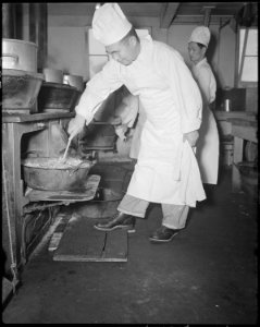 Minidoka Relocation Center. Kitchen crew preparing lunch. Menu, Baked macaroni with spanish sause . . . - NARA - 536589