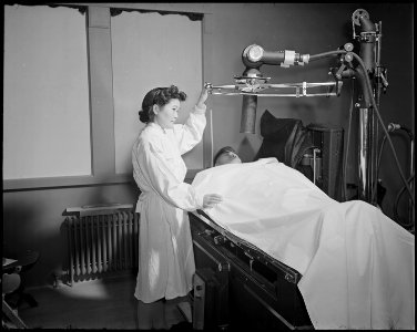 Minidoka Relocation Center. Mrs. Mabel Shigaya. X-ray technician. Hospital. View in X-ray Laboratory. - NARA - 536568