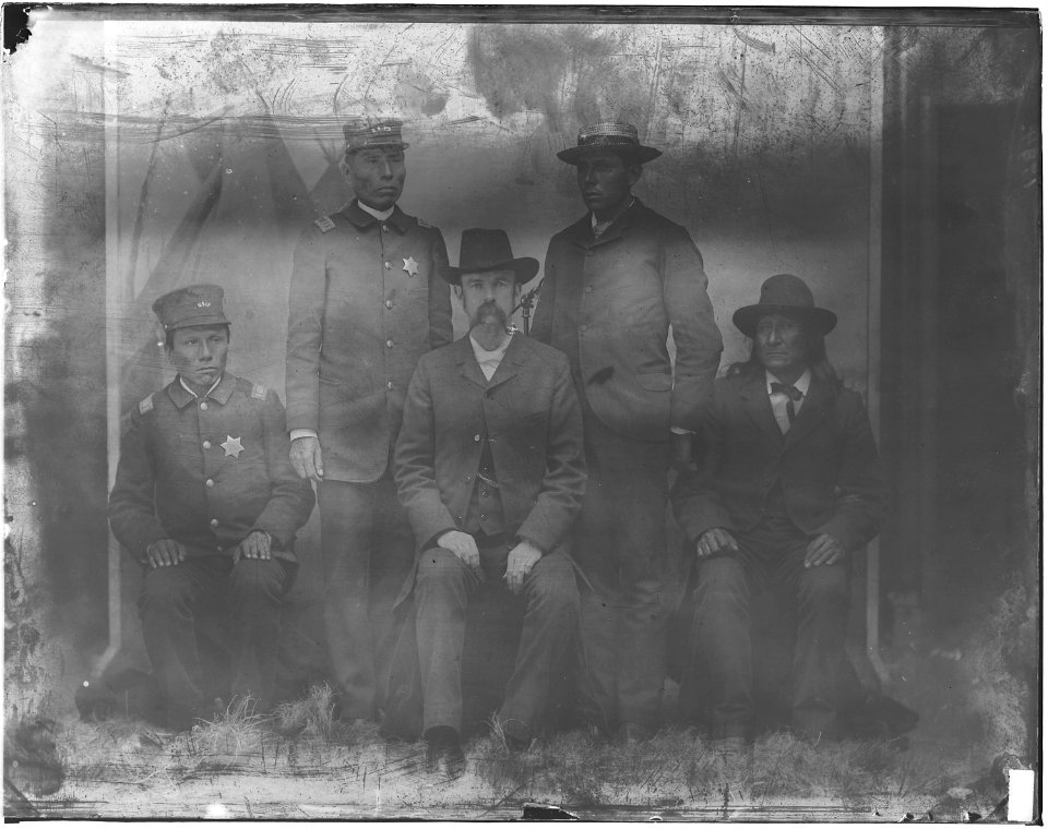 Members of U.S. Indian Police, with white man - NARA - 523707