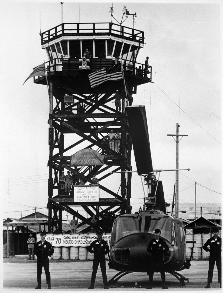 Moments before the U.S. flag was replaced by the Vietnamese flag, Vietnamese Air Force crewmen line up before one of the - NARA - 541860