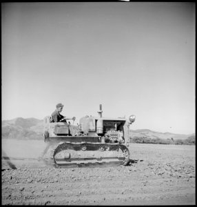 Monterey County, California. Rural youth. Mechanization, the agricultural employee. In leveling a field the... - NARA - 532173