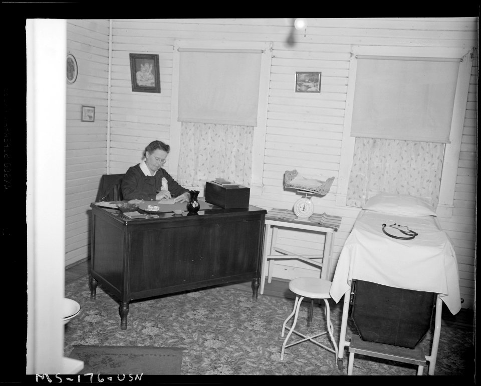 Mrs. Marion W. Griffith, Registered Nurse, at her desk in dispensary. Christopher Coal Company, Christopher ^3 Mine... - NARA - 540311