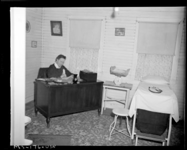 Mrs. Marion W. Griffith, Registered Nurse, at her desk in dispensary. Christopher Coal Company, Christopher ^3 Mine... - NARA - 540311