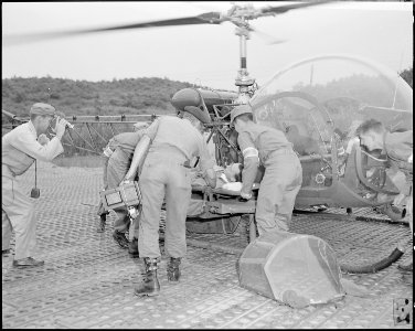 MUNSAN-ni, Korea- An unidentified POW (recently repatriated in the UN POW exchange) arrives by helicopter at Freedom... - NARA - 542270