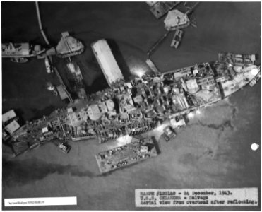 NASPH ^120140- 24 Dec 1943. USS Oklahoma - Salvage, Aerial view from overhead after refloating - NARA - 296921