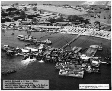 NASPH ^119944- 3 Nov 1943, USS Oklahoma- Salvage- Aerial view from port side aft during pumping operations for... - NARA - 296957