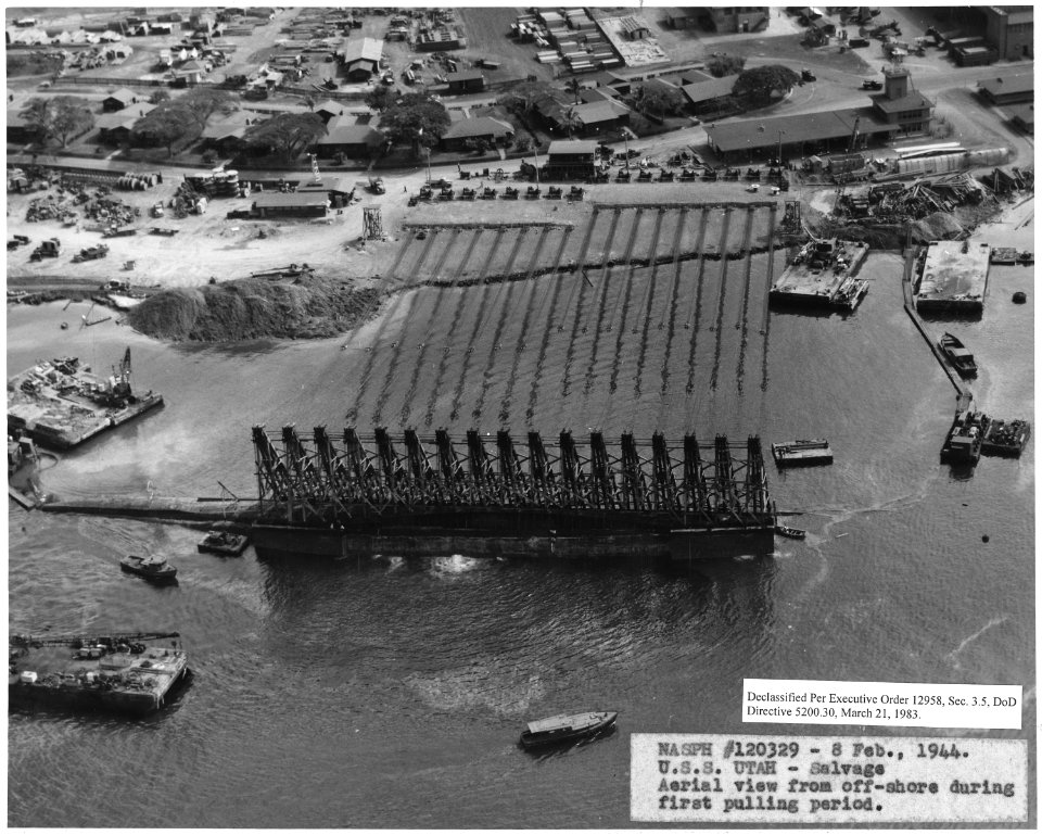 NASPH ^120329- 8 Feb 1944. USS Utah- Salvage, Aerial view from offshore during first pulling period - NARA - 296985