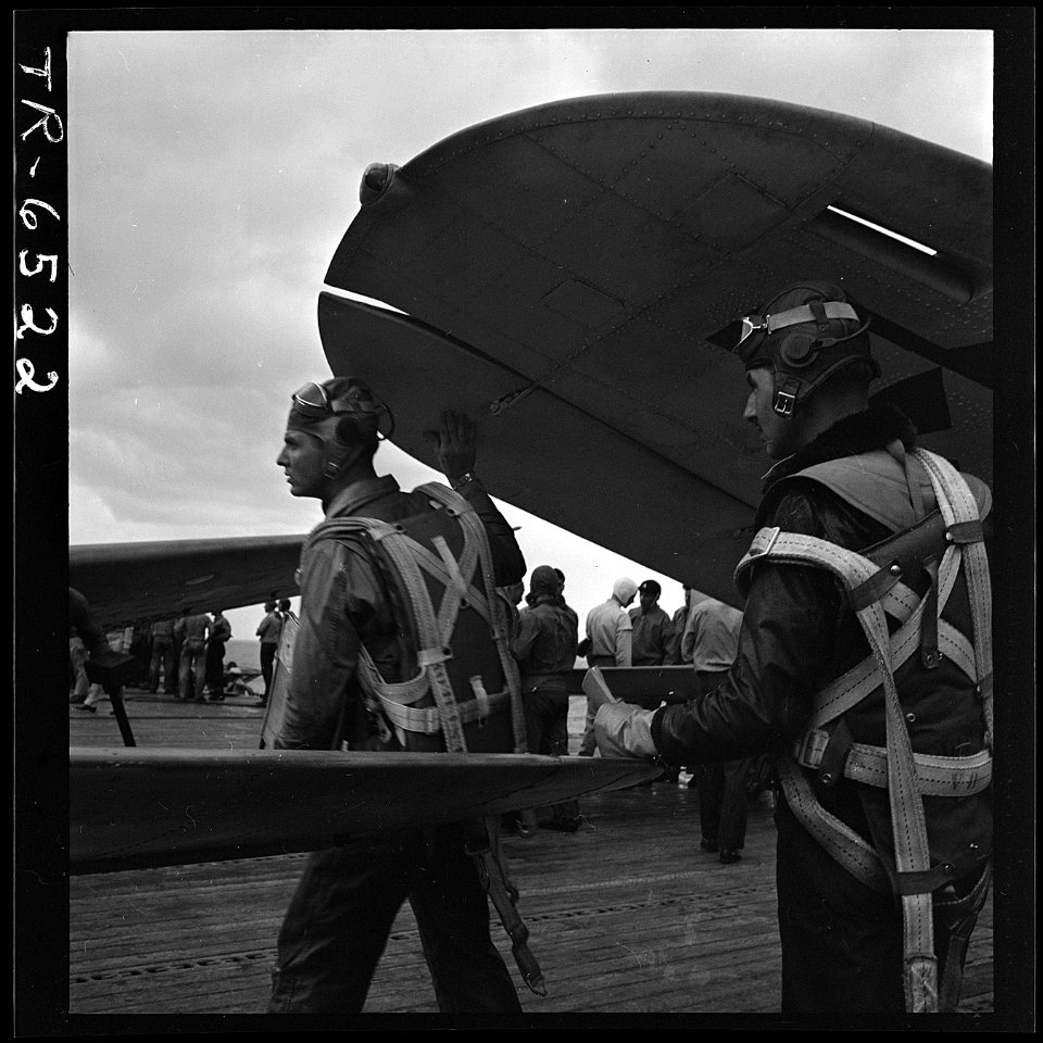 Navy pilots head for ready room after landing their planes on USS Yorktown CV-10. - NARA - 520947