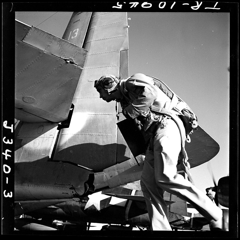 Navy TBM pilots hurrying to their planes aboard the USS Monterey (CVL-26) for strike on Guam. - NARA - 520857