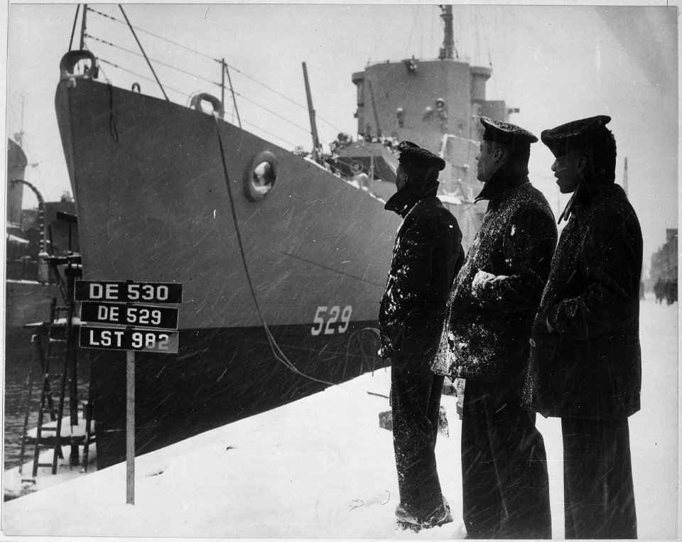 Negro sailors of the USS MASON commissioned at Boston Navy Yard 20 March 1944 proudly look over their ship which is... - NARA - 520644