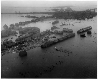Netherlands. Viewed from a U.S. Army helicopter, gives a hint of the tremendous damage damage wrought by the flood - NARA - 541705 photo
